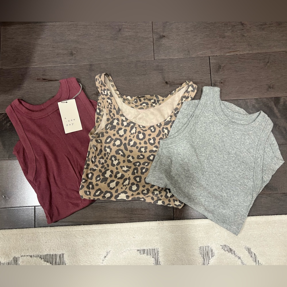 a new day Burgundy, Leopard, and Gray Tank Tops. Never worn
